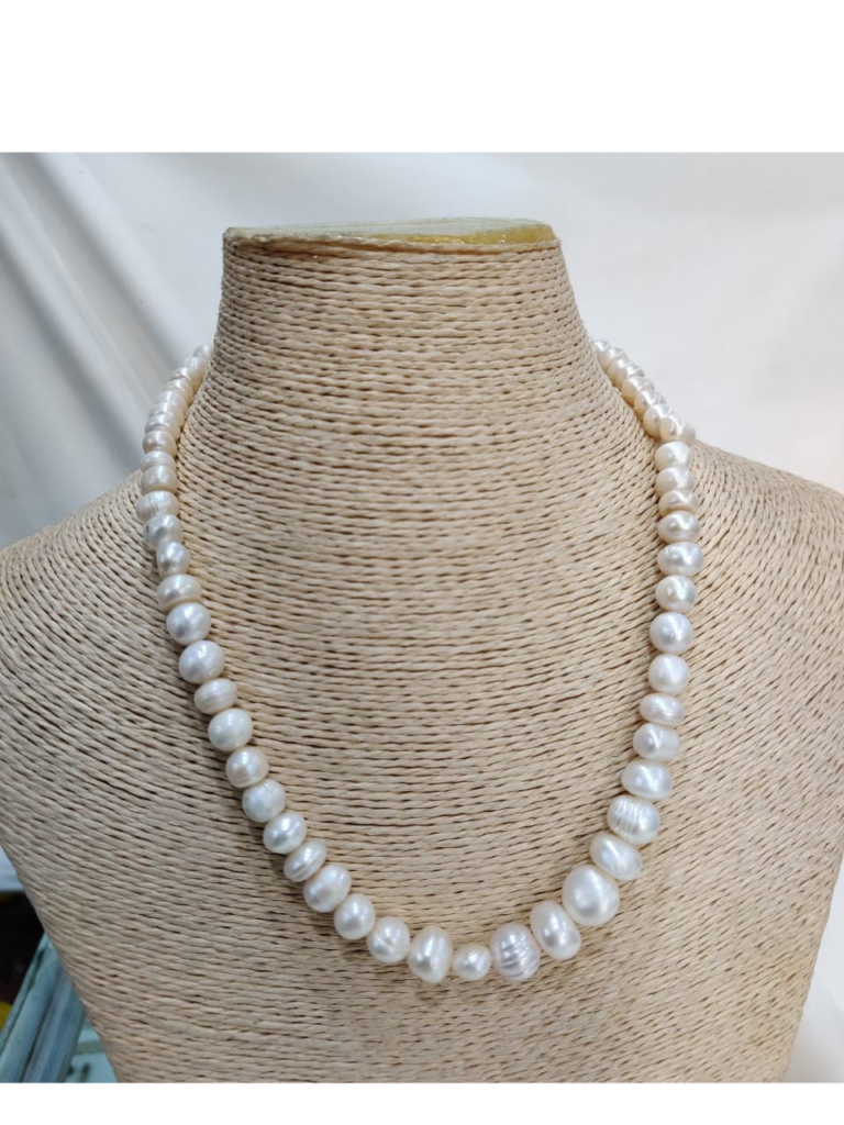 Freshwater Pearl Necklace displayed on a woven mannequin bust, featuring a single strand of luminous white pearls in varying sizes—handcrafted and elegant.